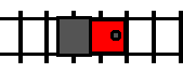 A train, facing right, traveling rightward along a track.