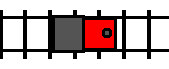 A train, facing right, traveling leftward along a track by backing up.